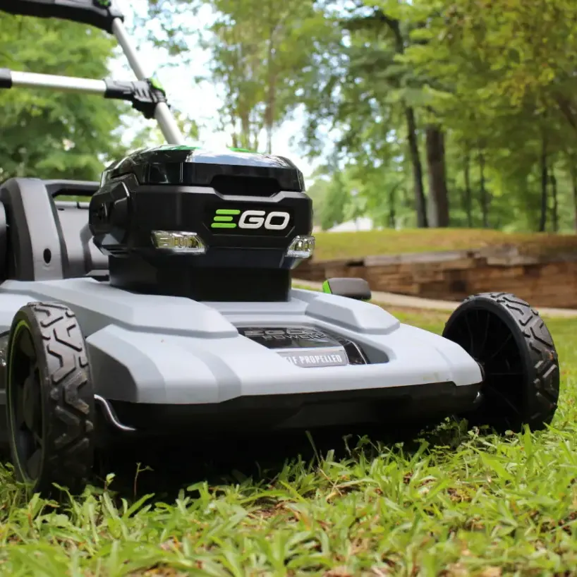 Zero-emission electric lawn mower used for quiet lawn care services